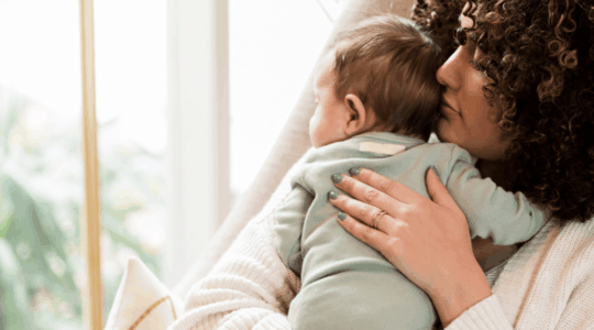 Mom-rocks-baby-at-home